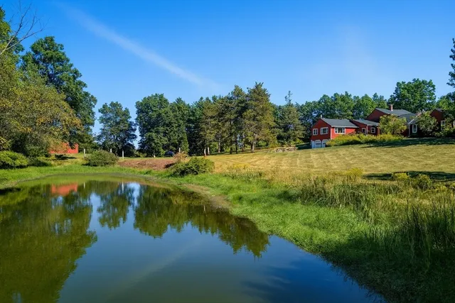 a backyard of a house with a lake view
