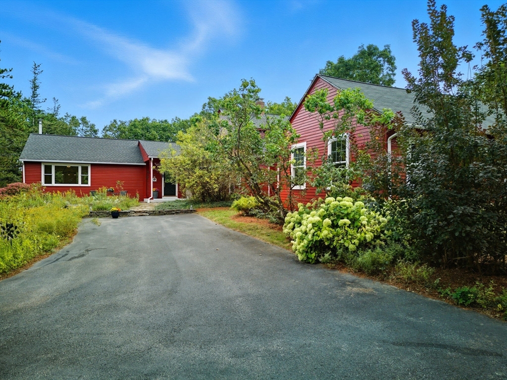 523 Martins Pond Road Groton, MA 01450 - Photo 4 of 4 a front view of a house with a yard and a street