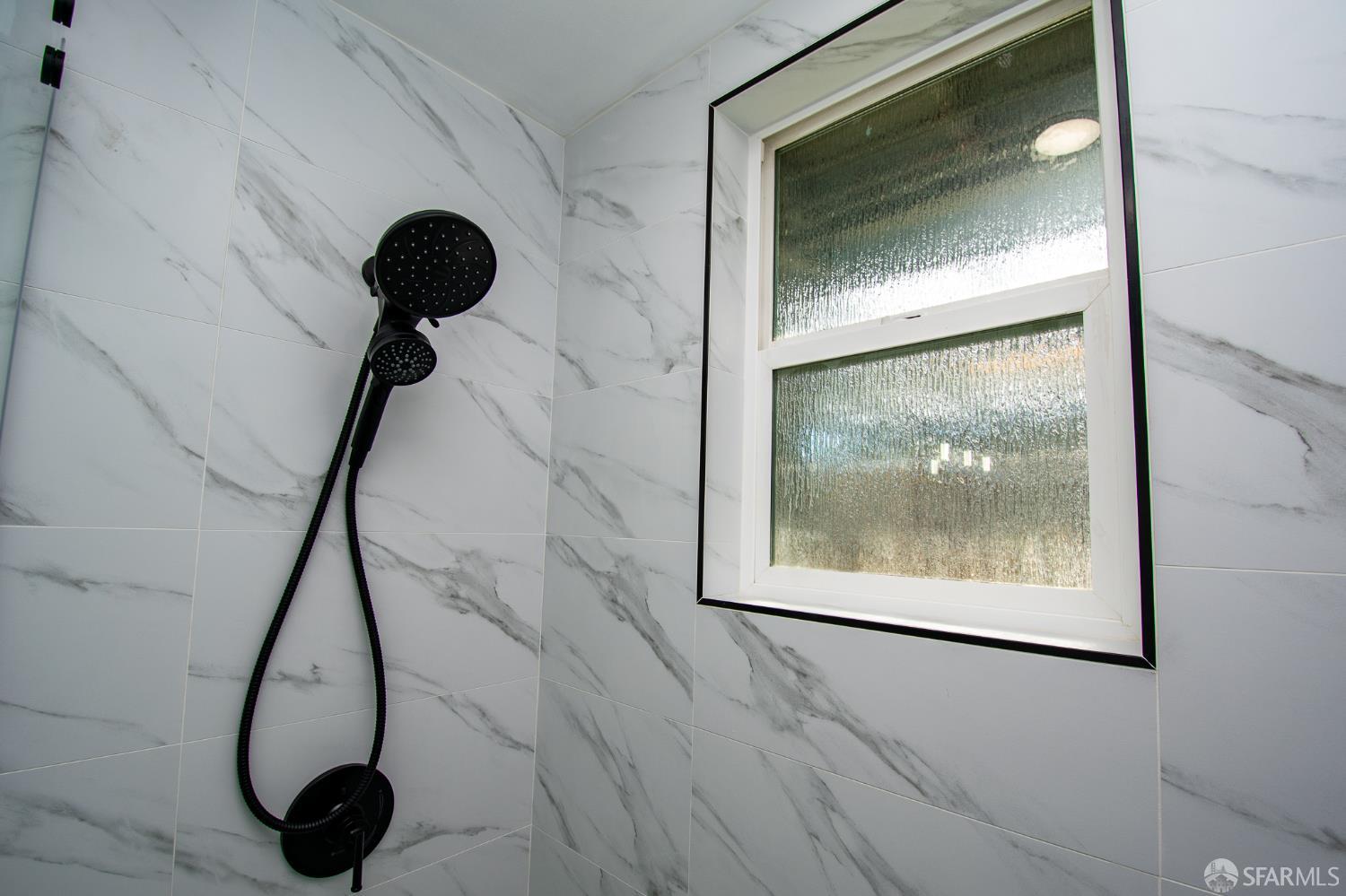 1099 Bradford Drive, Unit A Sunnyvale, CA 94089 - Photo 11 of 16 a room with wooden floor and a painting on the wall