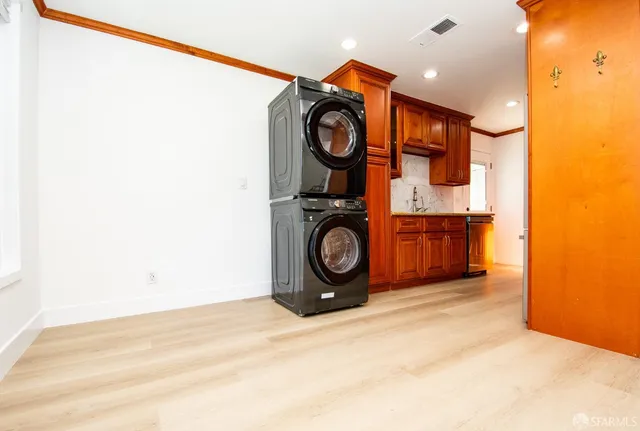 a view of a storage & utility room with washer and dryer