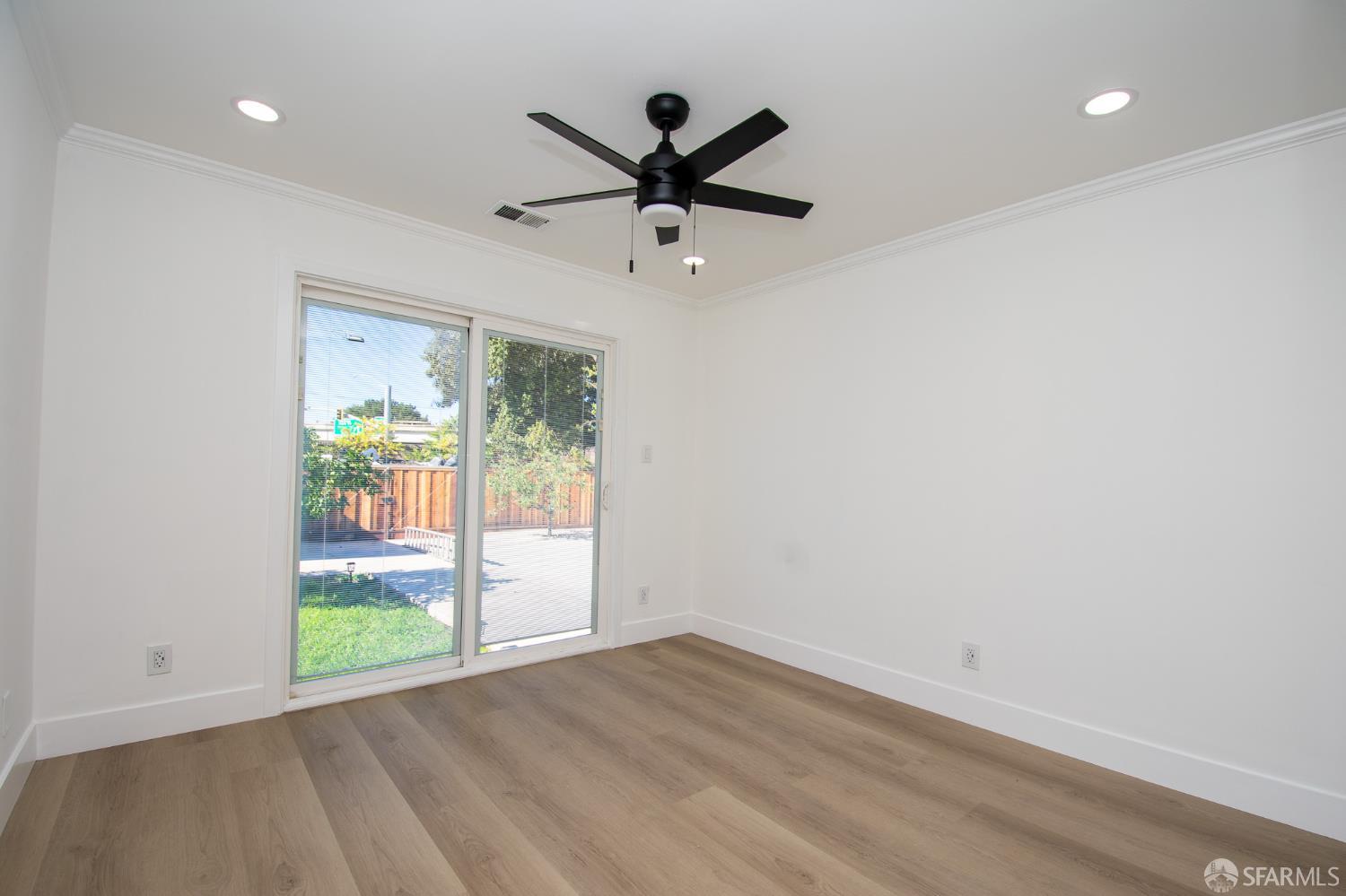 1099 Bradford Drive, Unit A Sunnyvale, CA 94089 - Photo 7 of 16 wooden floor in an empty room with a window