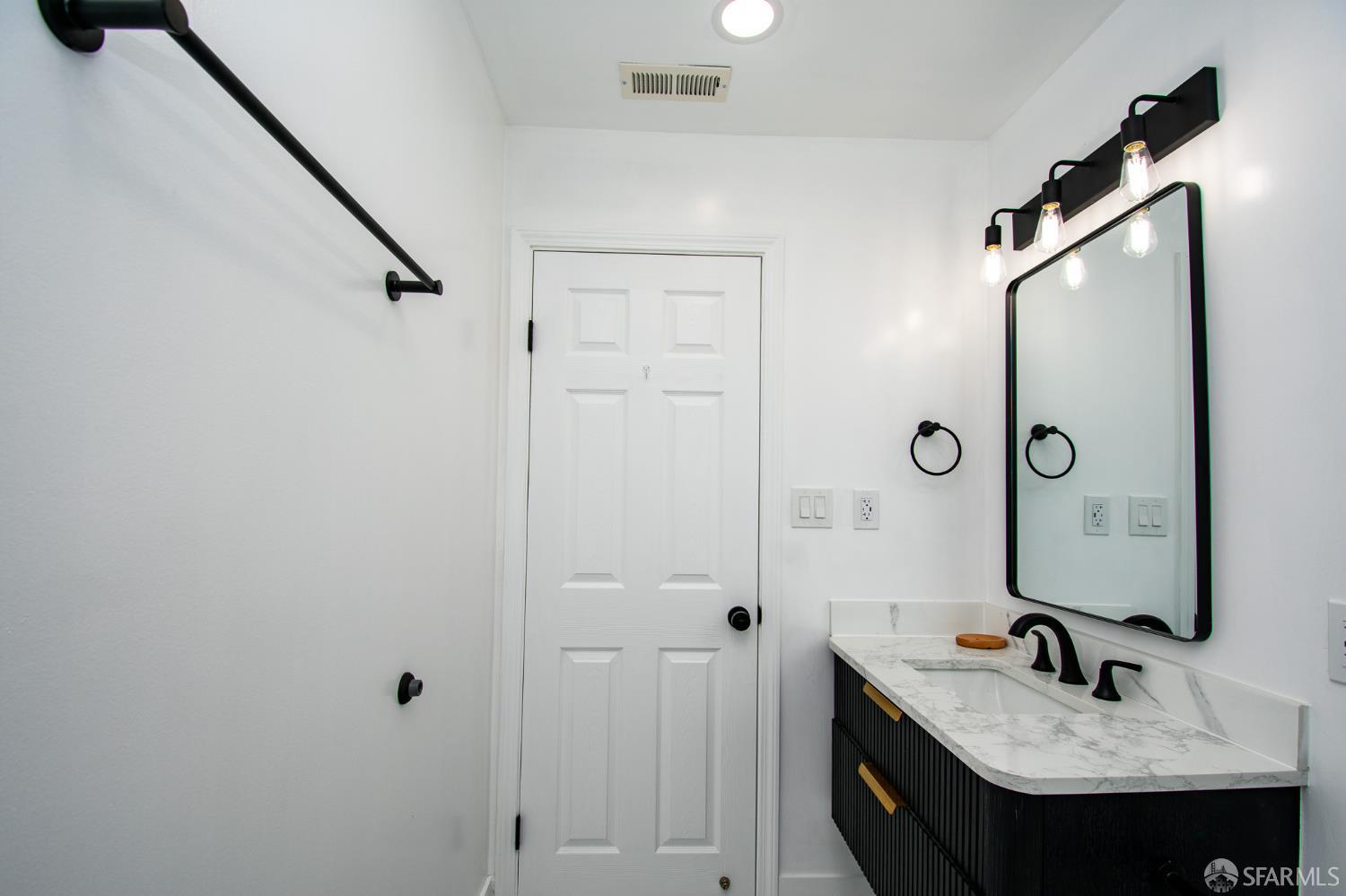 1099 Bradford Drive, Unit A Sunnyvale, CA 94089 - Photo 10 of 16 a bathroom with a sink and a mirror