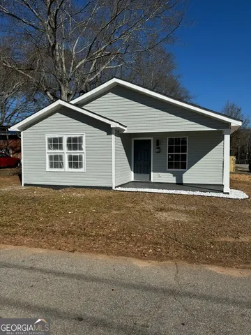a front view of a house with garage