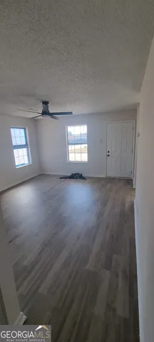 a bathroom with a bathtub sink and mirror