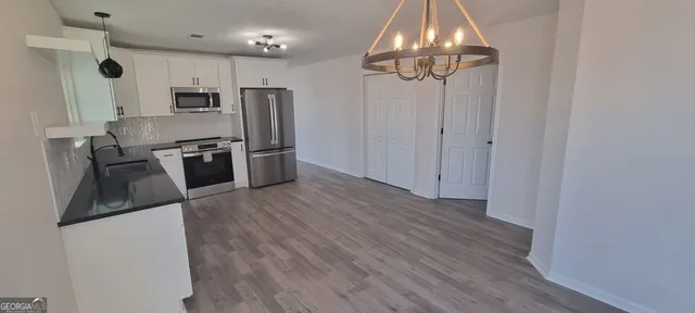a view of wooden door with staircase
