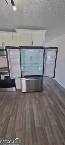 a bathroom with a sink toilet and mirror