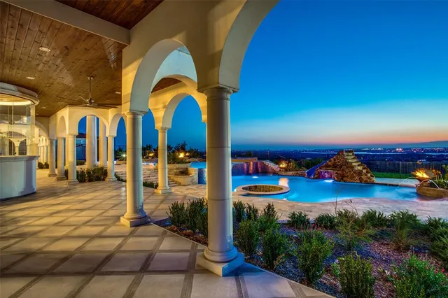 a view of swimming pool with outdoor seating and yard