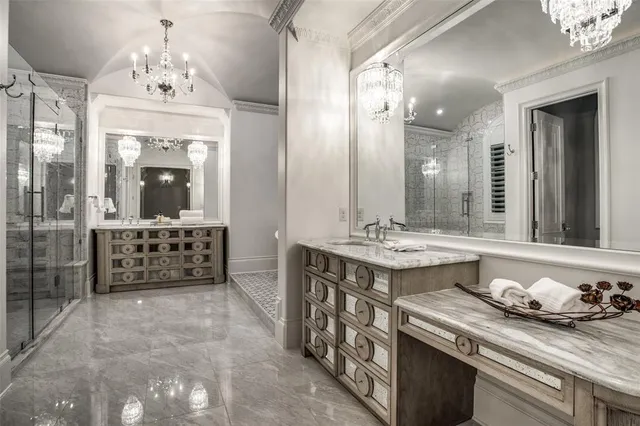 a spacious bathroom with a granite countertop sink mirror and a shower