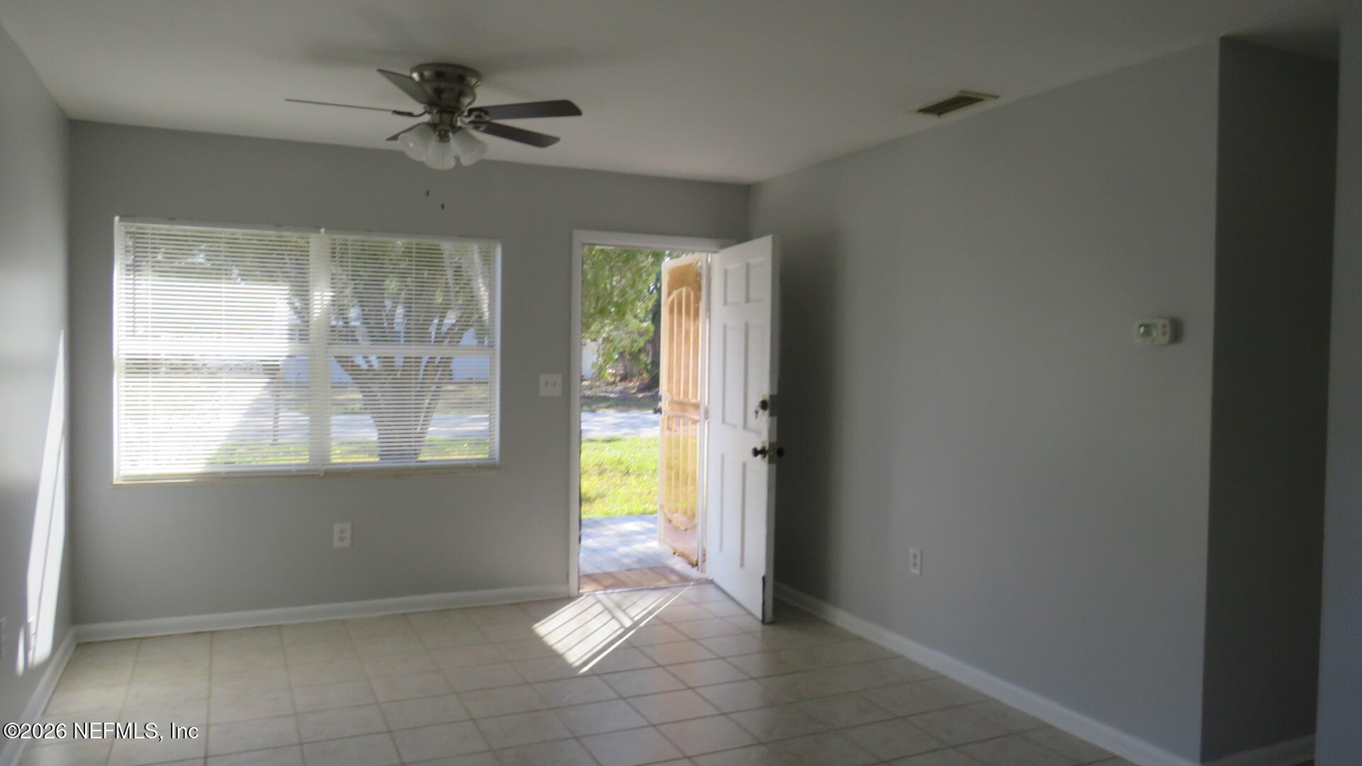 3412 Brockway Road Jacksonville, FL 32250 - Photo 5 of 16 a view of an empty room and window