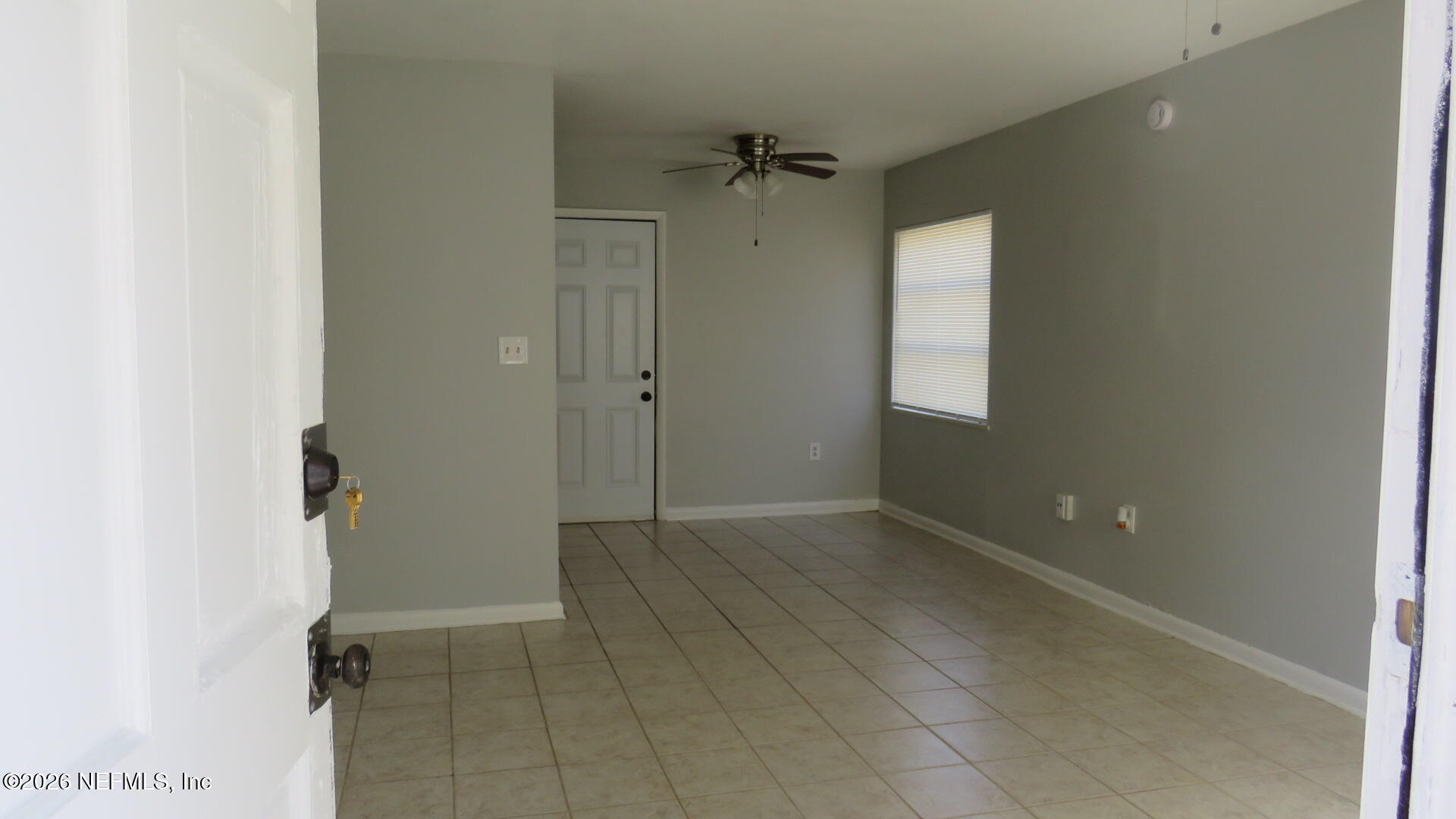 3412 Brockway Road Jacksonville, FL 32250 - Photo 6 of 16 an empty room with windows
