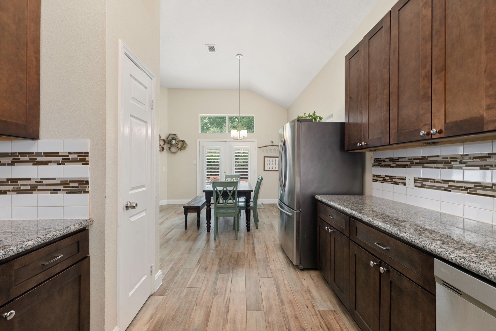 1915 Mercoal Drive Spring, TX 77386 - Photo 15 of 50 Kitchen offering convenient access to the dining area with plenty of cabinet and workspace.