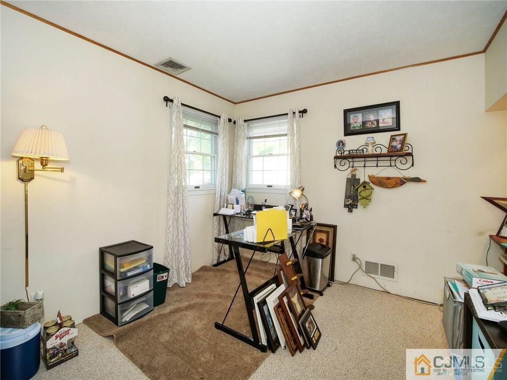 13 Stiles Road Edison, NJ 08817 - Photo 11 of 24 a view of a workspace with furniture and a window