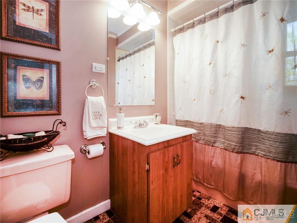 13 Stiles Road Edison, NJ 08817 - Photo 12 of 24 a utility room with dryer and washer