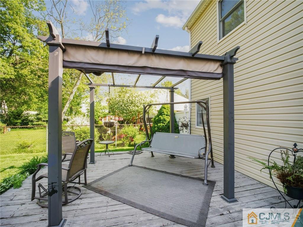 13 Stiles Road Edison, NJ 08817 - Photo 20 of 24 a balcony with furniture and a potted plant
