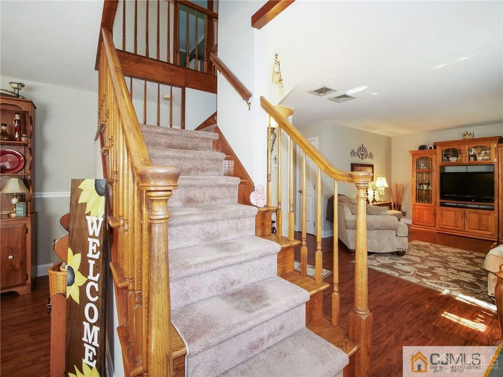 13 Stiles Road Edison, NJ 08817 - Photo 3 of 24 a view of entryway and hall with wooden floor