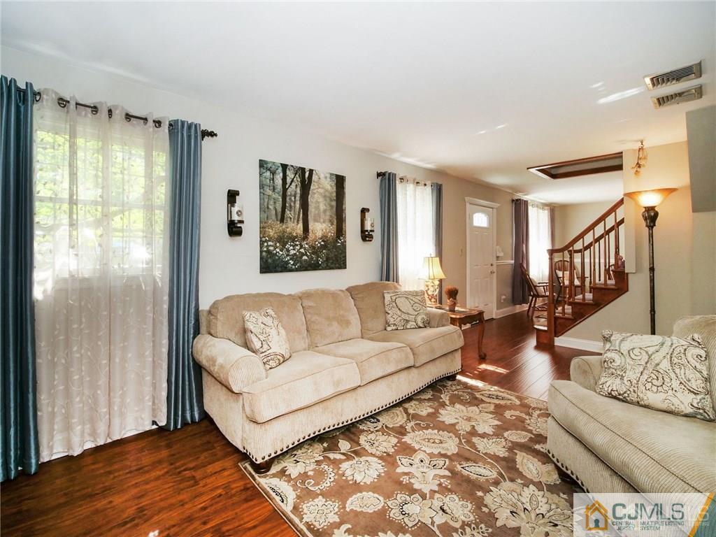 13 Stiles Road Edison, NJ 08817 - Photo 5 of 24 a living room with furniture and a large window