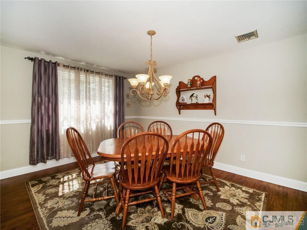 13 Stiles Road Edison, NJ 08817 - Photo 6 of 24 a view of a dining room with furniture window and outside view