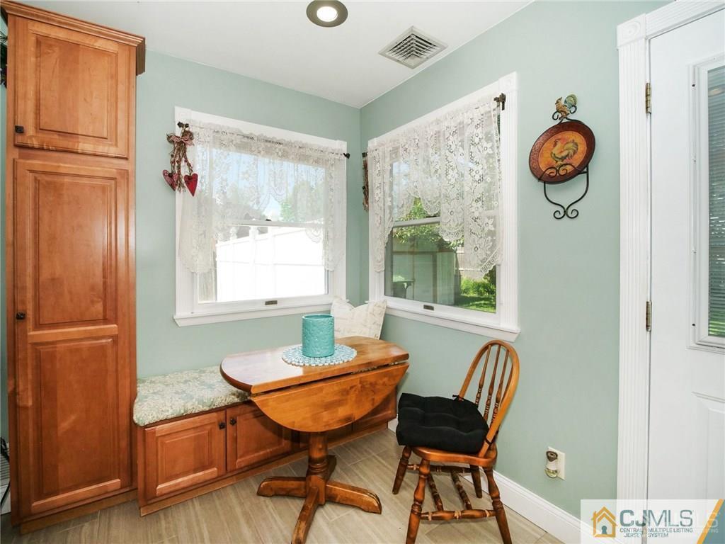 13 Stiles Road Edison, NJ 08817 - Photo 9 of 24 a view of a room with furniture window and wooden floor