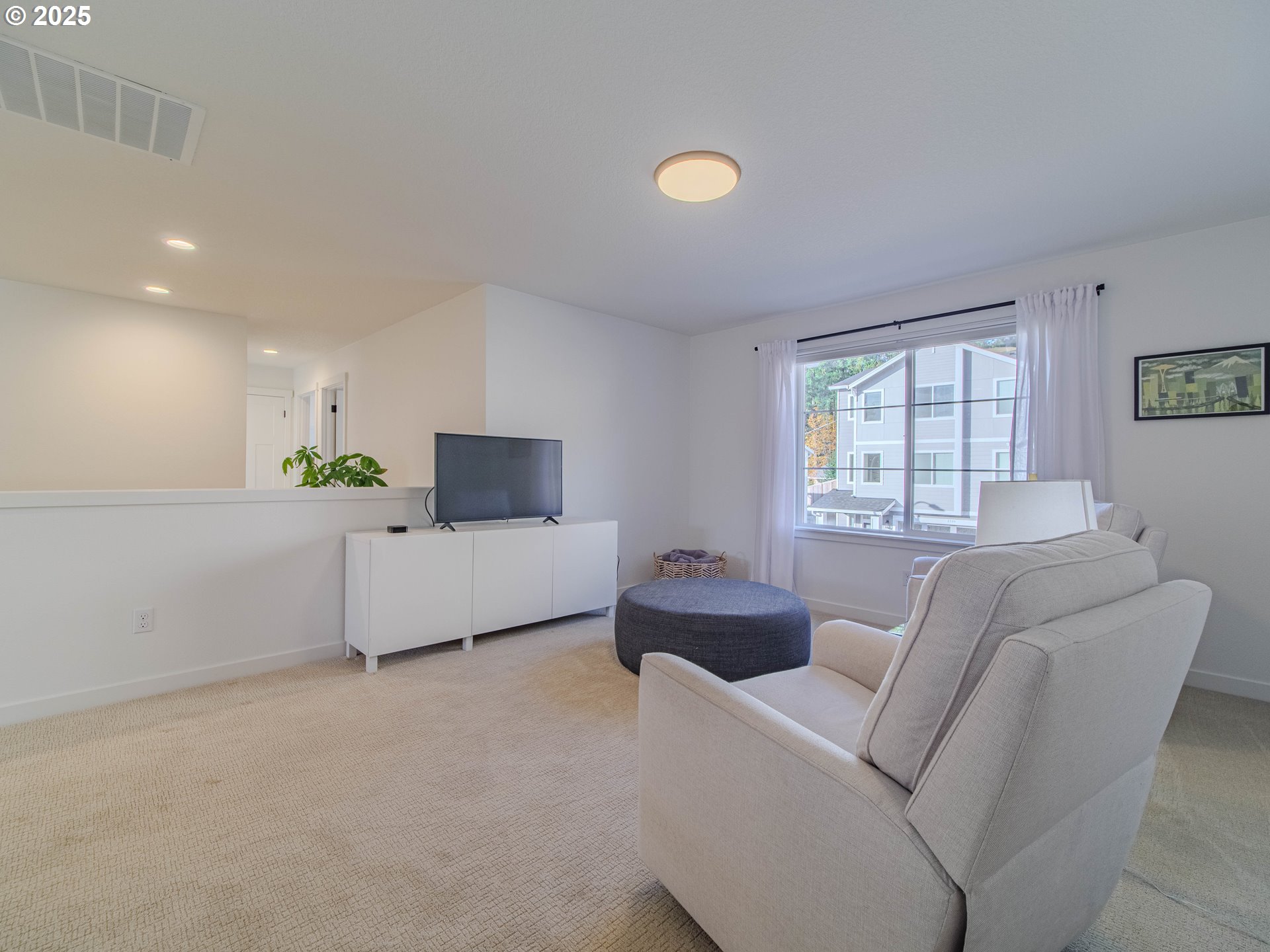 8588 Summit Court Portland, OR 97225 - Photo 13 of 22 a living room with furniture and a flat screen tv