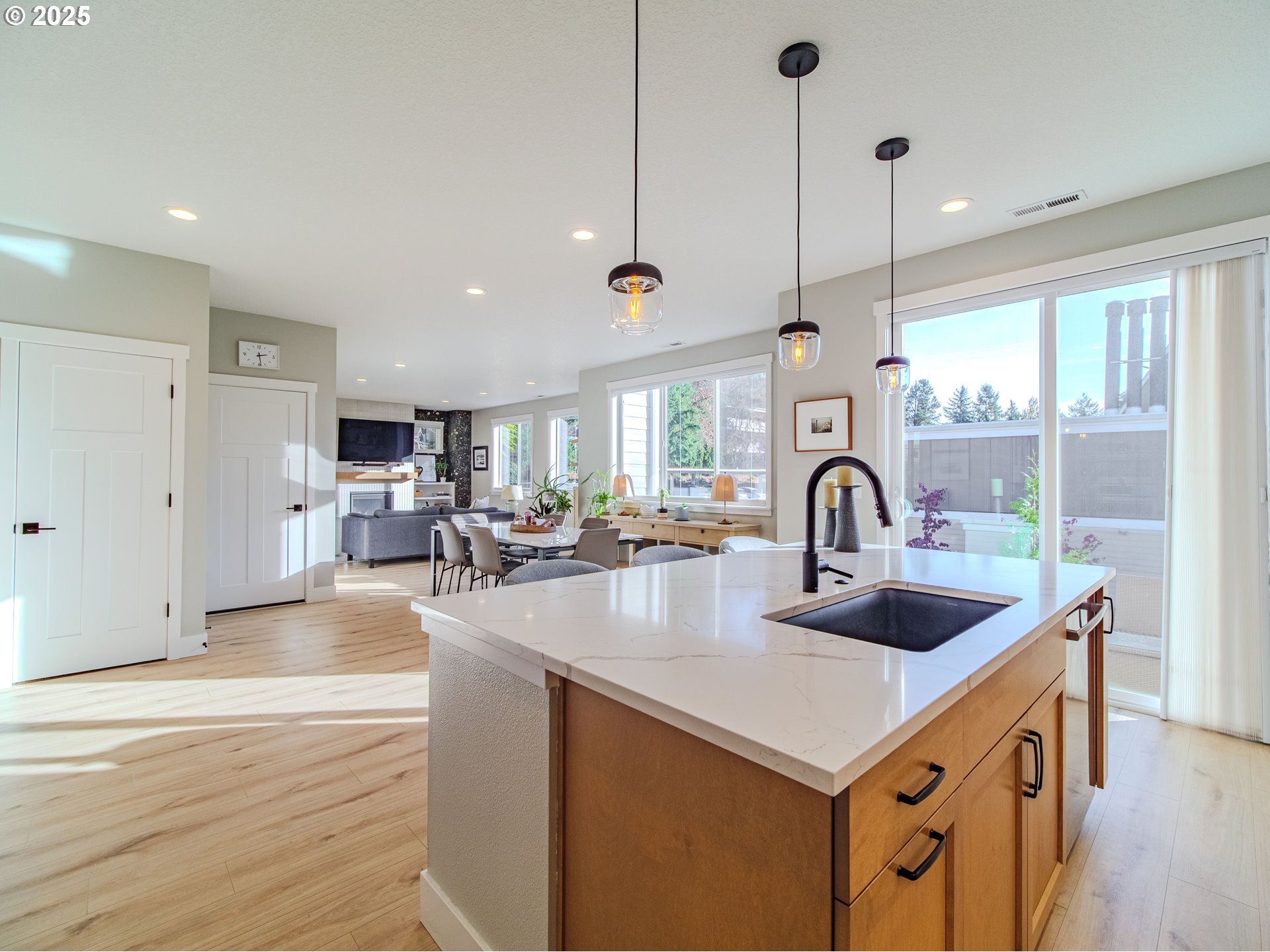 8588 Summit Court Portland, OR 97225 - Photo 7 of 22 a kitchen with sink a counter and cabinets