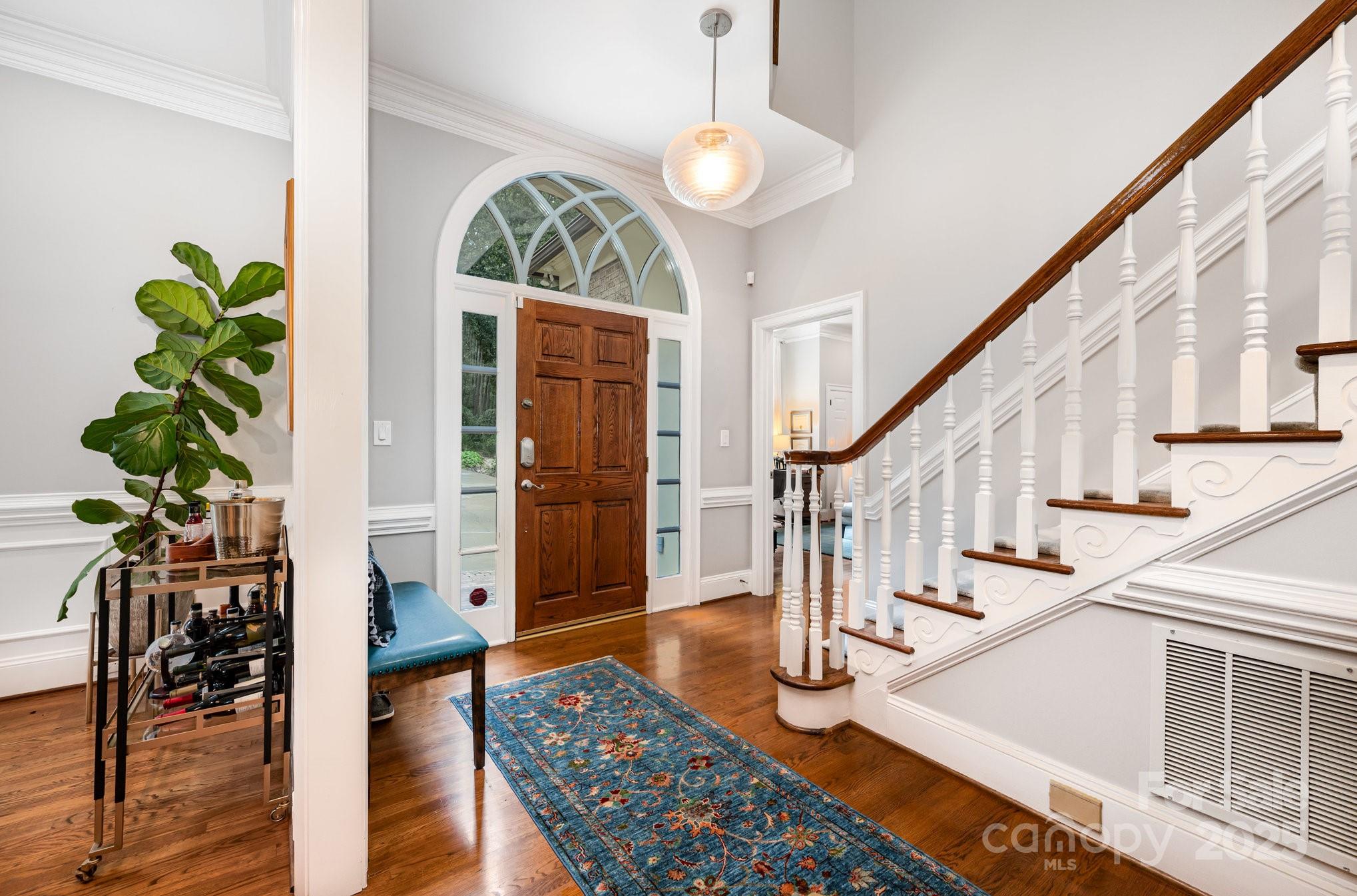 16133 North Point Road Huntersville, NC 28078 - Photo 11 of 48 a view of entryway and hall with wooden floor