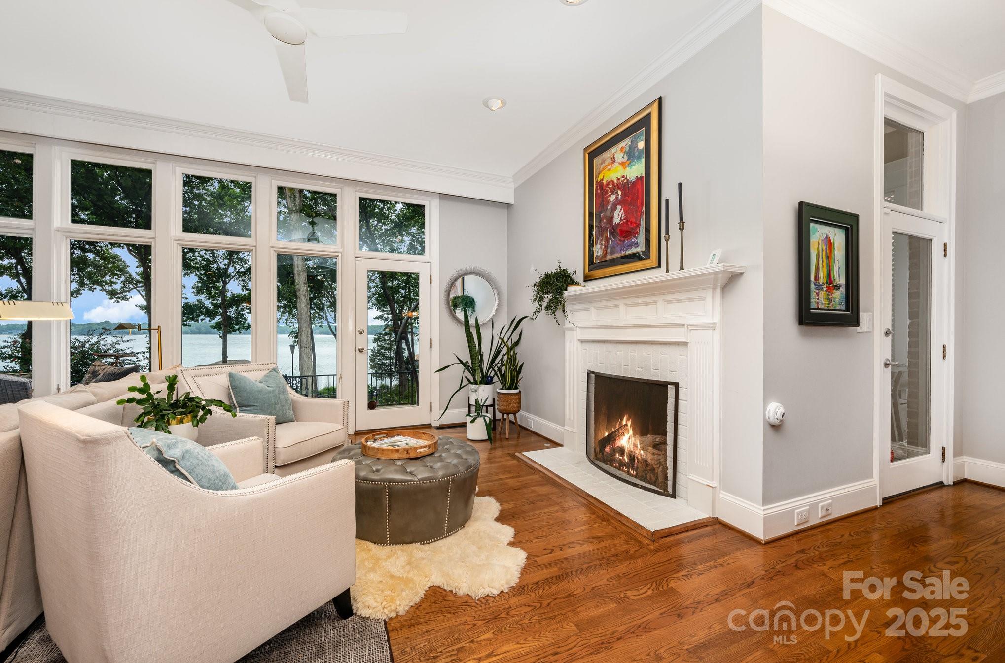 16133 North Point Road Huntersville, NC 28078 - Photo 15 of 48 a living room with furniture a fireplace and windows