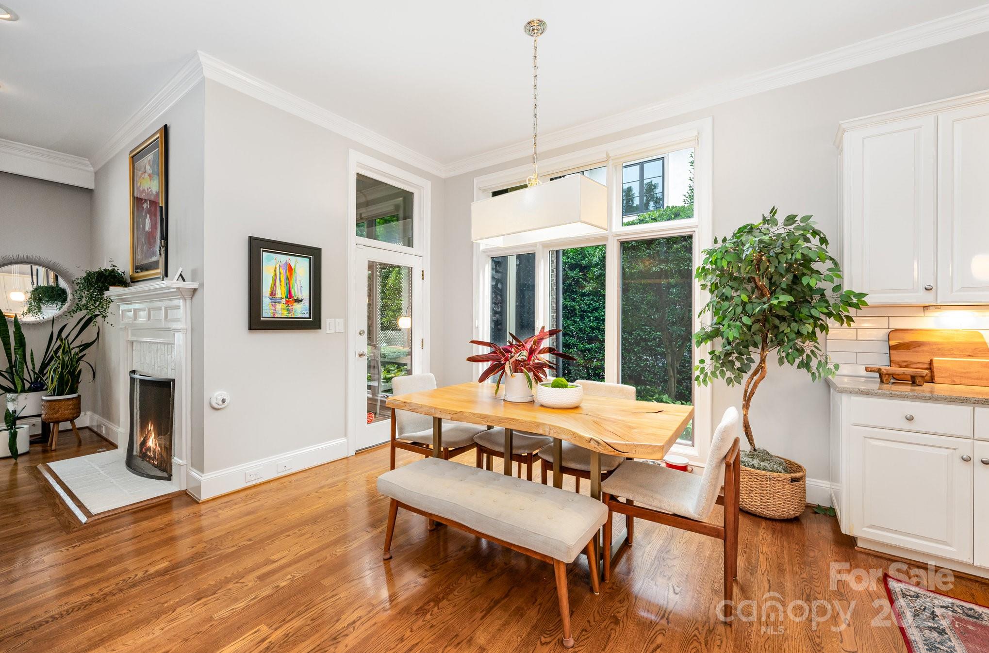 16133 North Point Road Huntersville, NC 28078 - Photo 16 of 48 a view of a dining room with furniture window and wooden floor