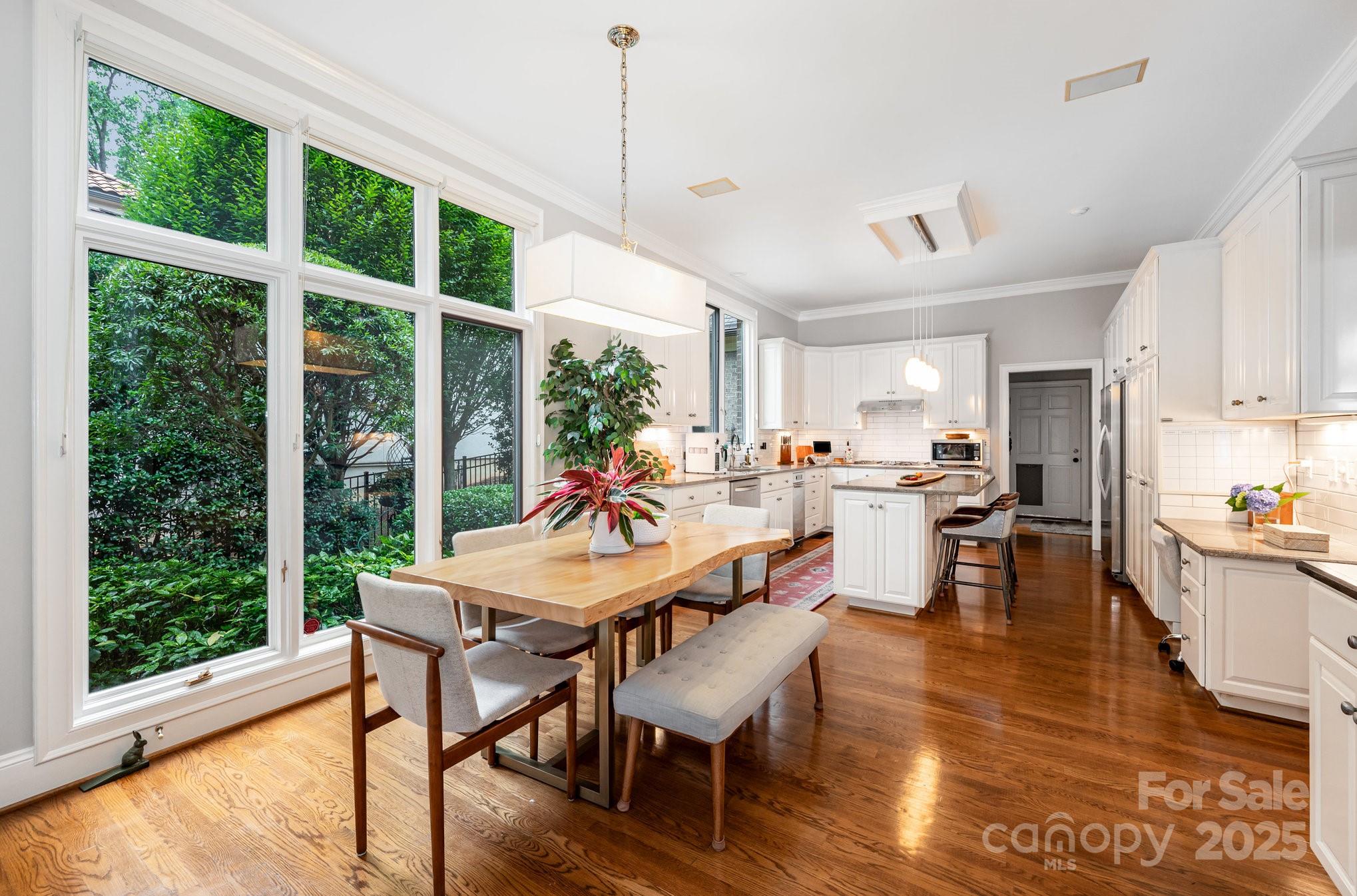 16133 North Point Road Huntersville, NC 28078 - Photo 17 of 48 a view of a dining room with furniture window and wooden floor