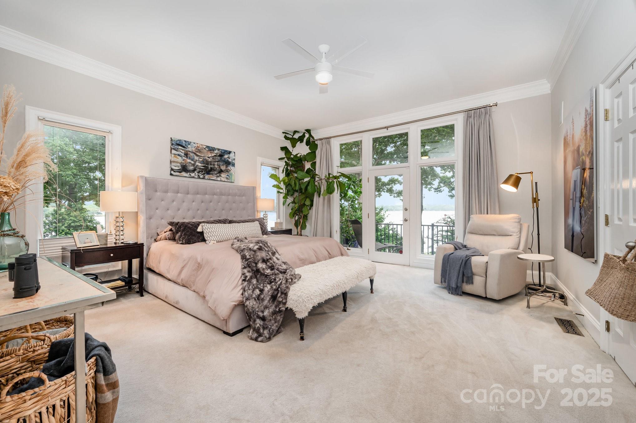 16133 North Point Road Huntersville, NC 28078 - Photo 21 of 48 a bedroom with a bed and a large window