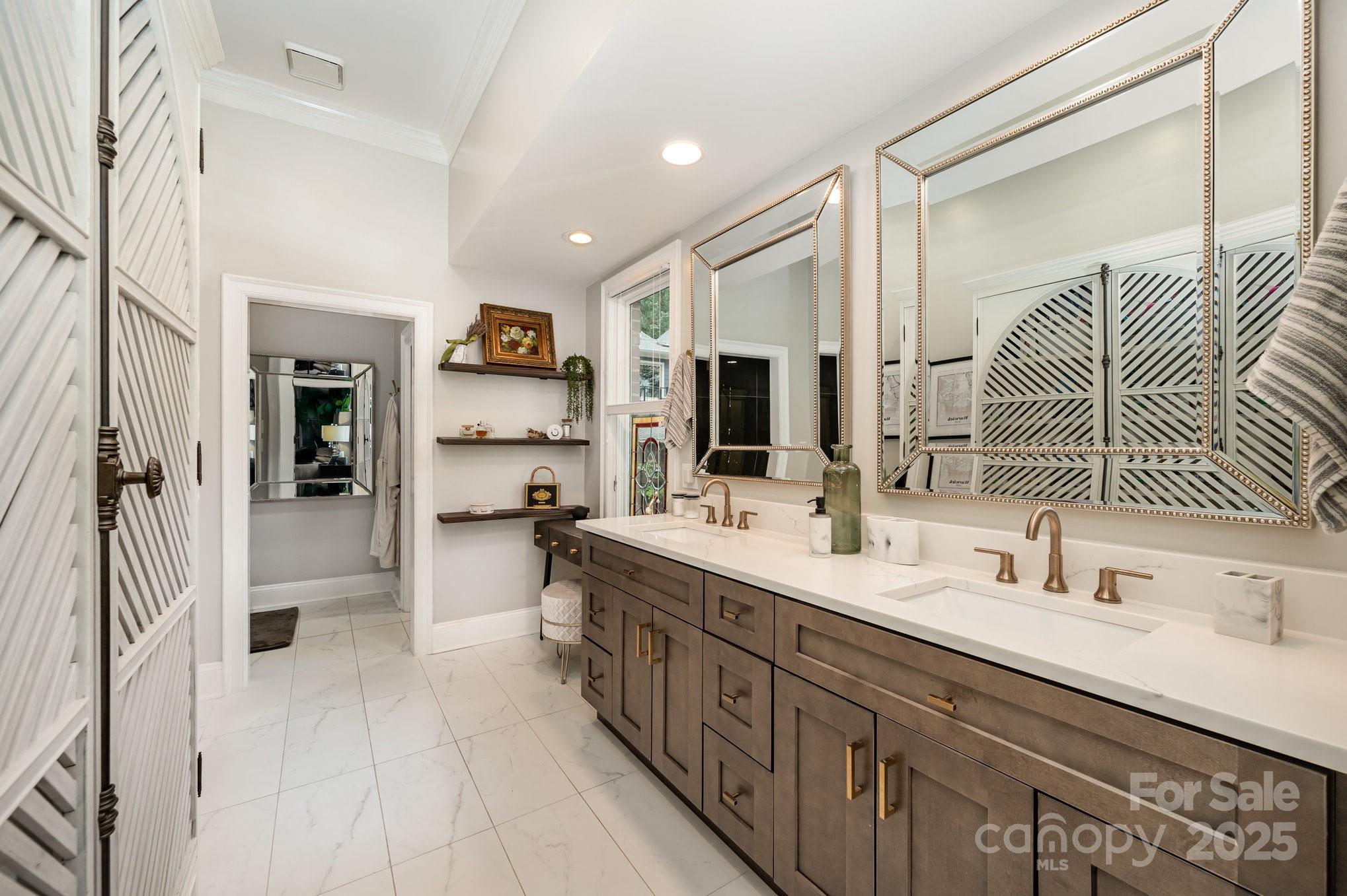 16133 North Point Road Huntersville, NC 28078 - Photo 22 of 48 a bathroom with a double vanity sink a mirror and shower