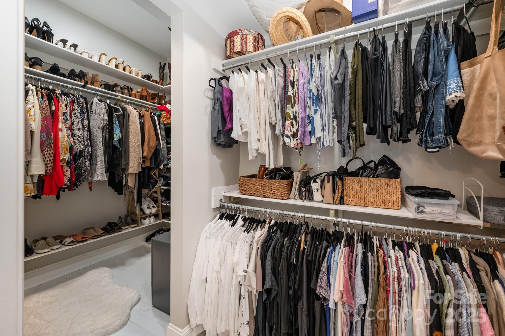 16133 North Point Road Huntersville, NC 28078 - Photo 24 of 48 a view of walk in closet with clothes and shoes