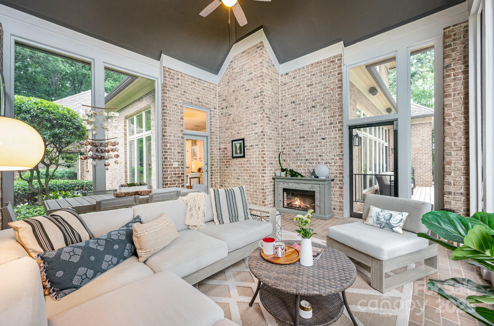 16133 North Point Road Huntersville, NC 28078 - Photo 29 of 48 a living room with fireplace furniture and a large window