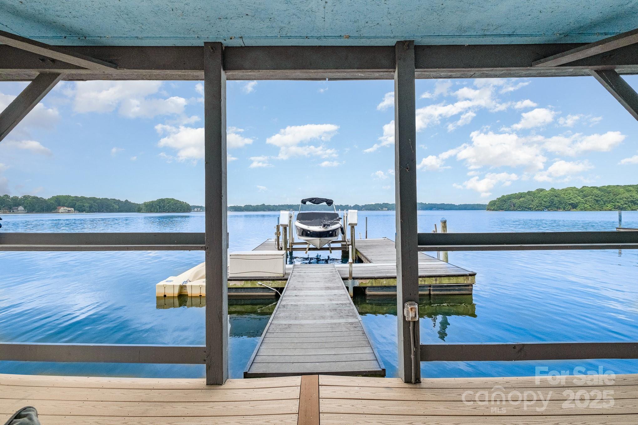 16133 North Point Road Huntersville, NC 28078 - Photo 3 of 48 a view of a floor to ceiling window with wooden floor