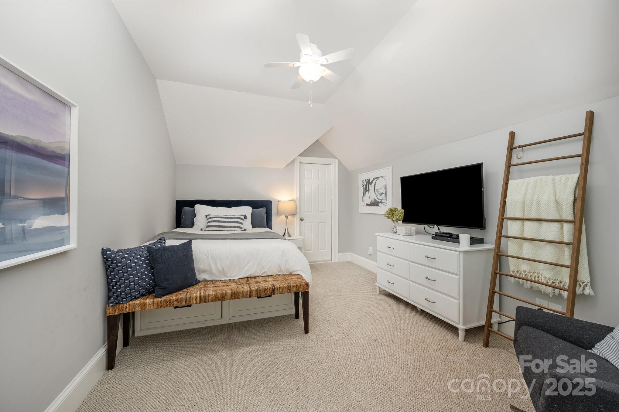 16133 North Point Road Huntersville, NC 28078 - Photo 37 of 48 a bedroom with furniture and flat screen tv