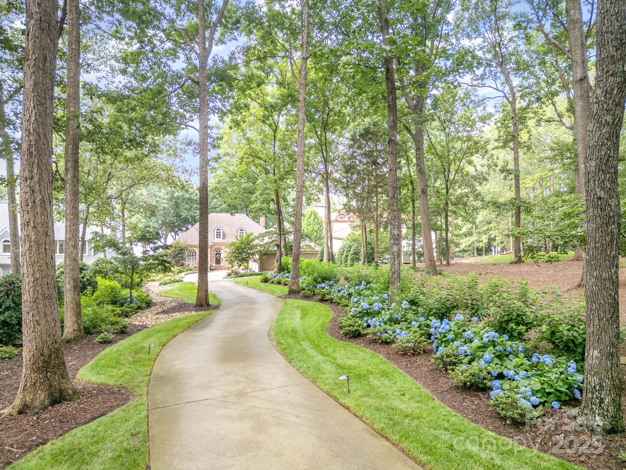16133 North Point Road Huntersville, NC 28078 - Photo 6 of 48 a view of a garden with pathway