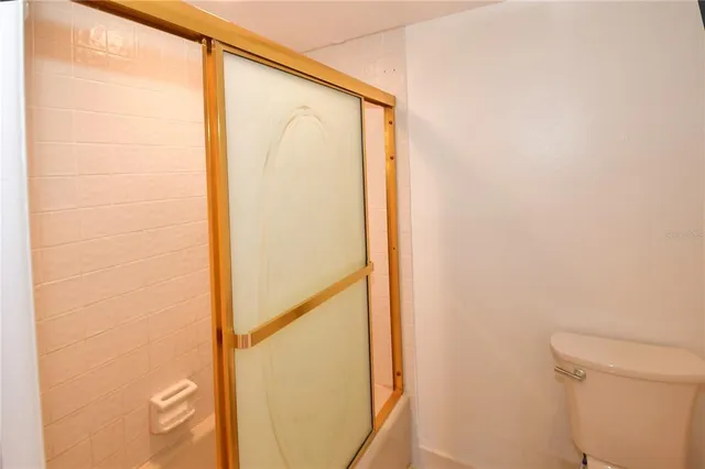 a swimming pool with outdoor seating and yard