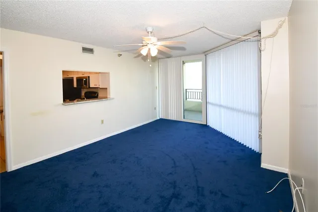 a kitchen with stainless steel appliances granite countertop a refrigerator stove and microwave