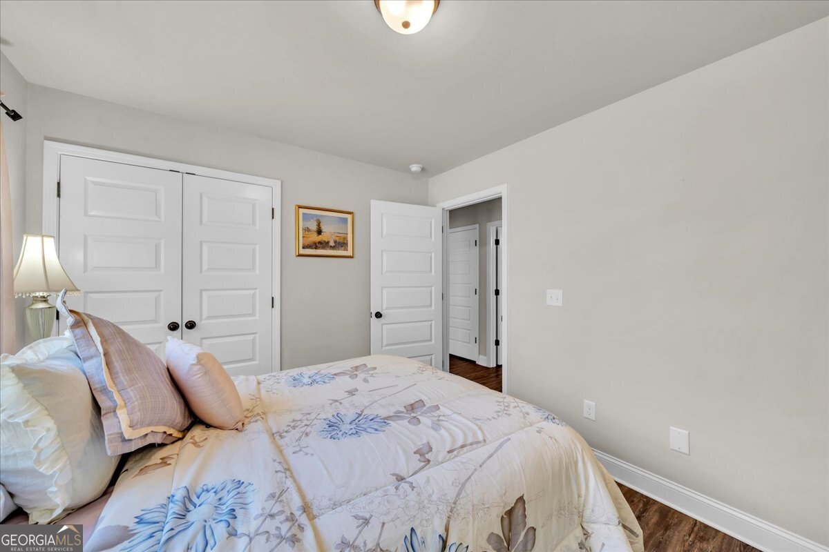 773 Weldon Road Forsyth, GA 31029 - Photo 22 of 37 a bedroom with a bed and a window