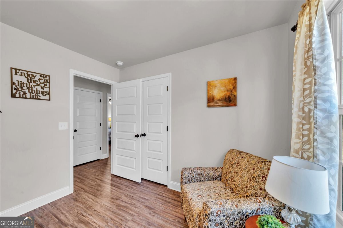 773 Weldon Road Forsyth, GA 31029 - Photo 26 of 37 a bedroom with furniture and a window