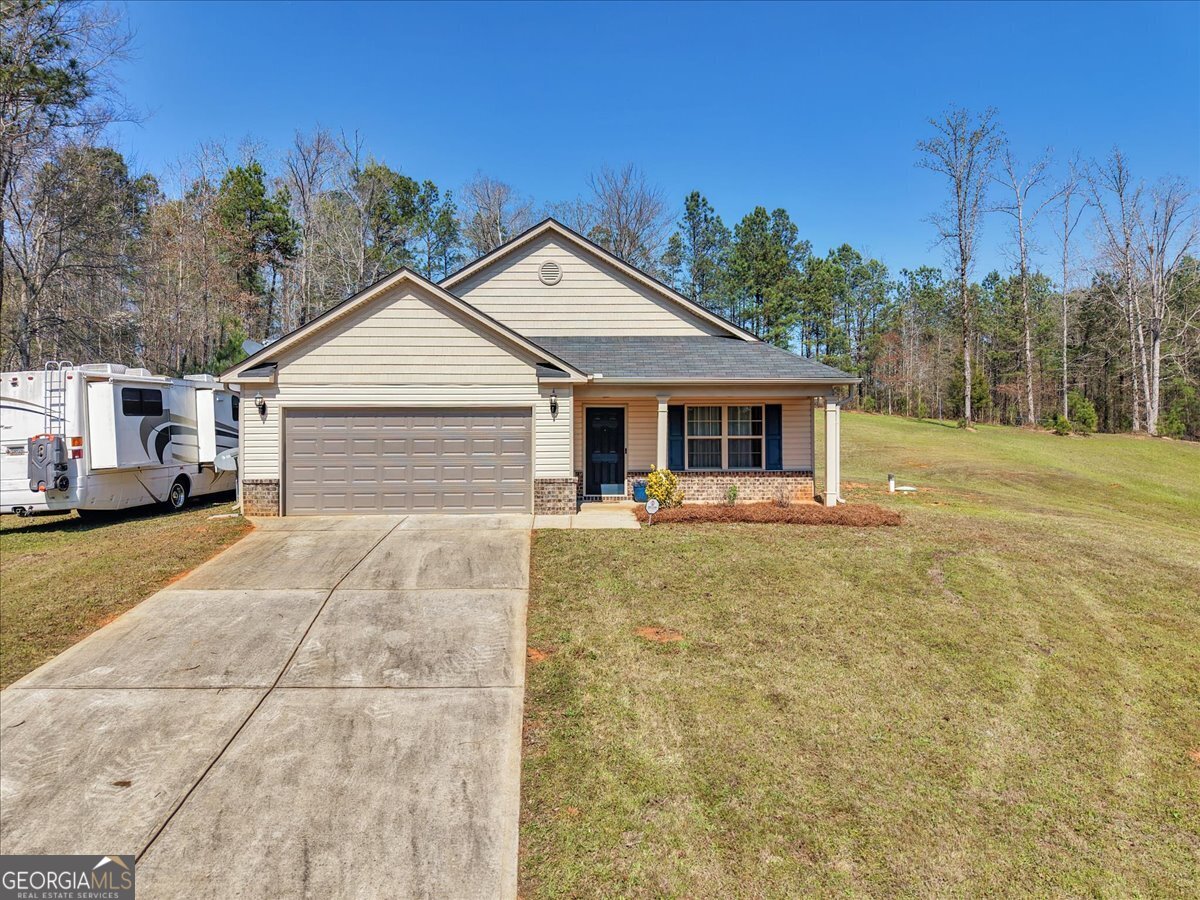 773 Weldon Road Forsyth, GA 31029 - Photo 30 of 37 a view of a house with a yard and tree s