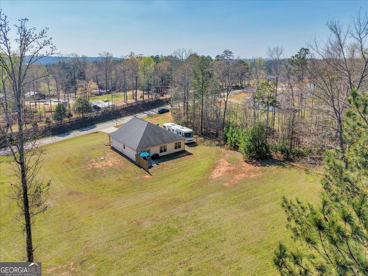 773 Weldon Road Forsyth, GA 31029 - Photo 31 of 37 a swimming pool view with a lake view