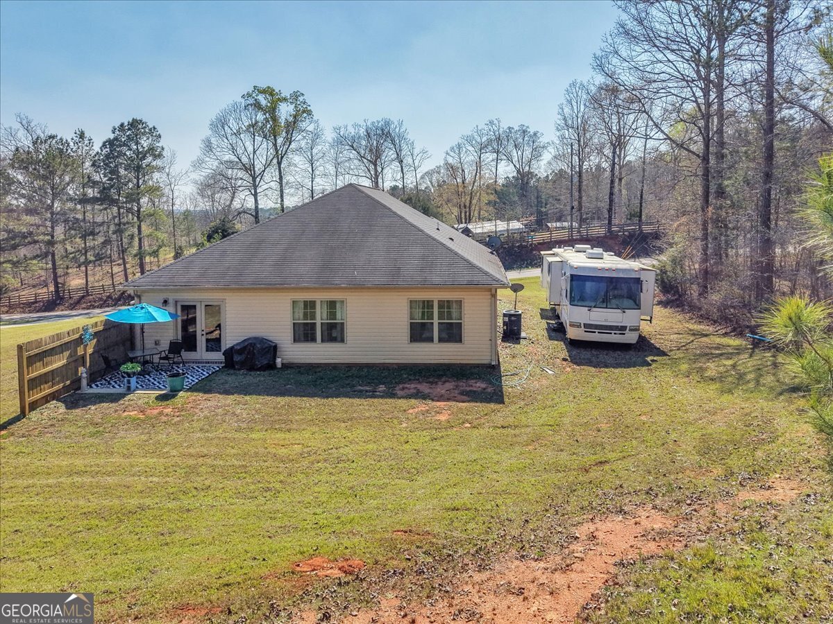 773 Weldon Road Forsyth, GA 31029 - Photo 33 of 37 a view of a house with swimming pool and sitting area