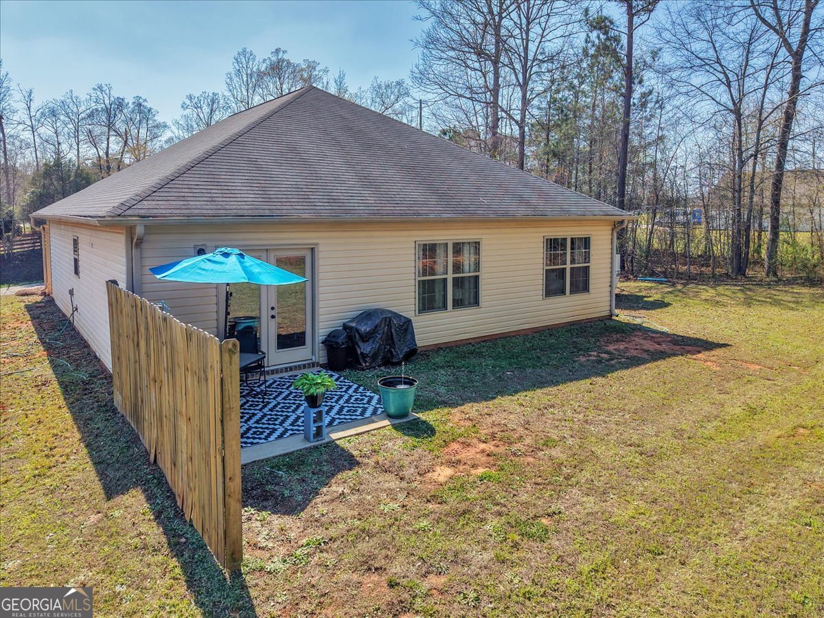 773 Weldon Road Forsyth, GA 31029 - Photo 34 of 37 a view of a house with backyard and trees