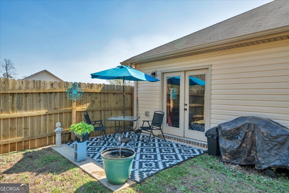 773 Weldon Road Forsyth, GA 31029 - Photo 35 of 37 a view of a patio with couches chairs and potted plants