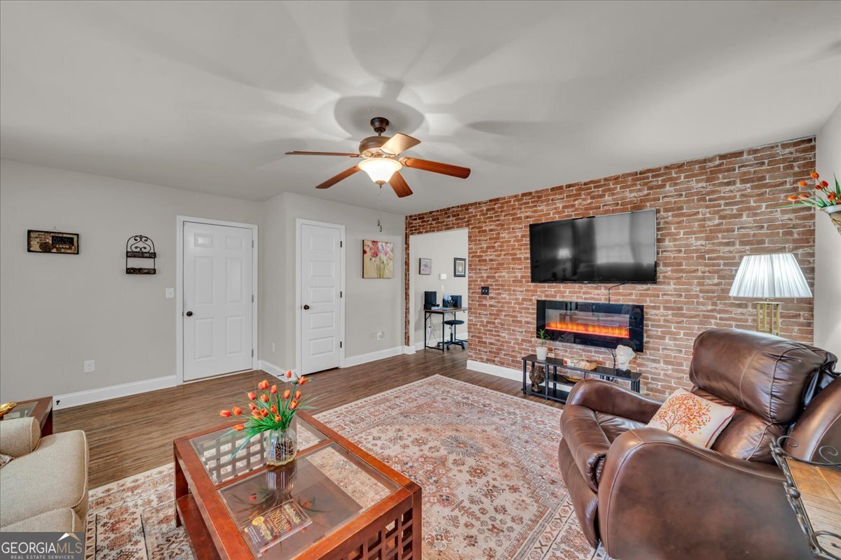 773 Weldon Road Forsyth, GA 31029 - Photo 5 of 37 a living room with furniture and a flat screen tv