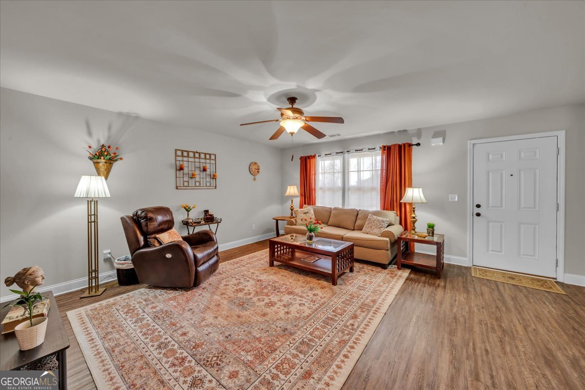 773 Weldon Road Forsyth, GA 31029 - Photo 6 of 37 a living room with furniture rug and window