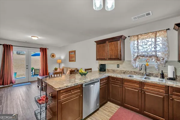 a kitchen with a sink stove and cabinets