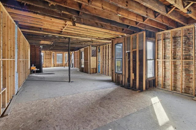 a view of a room with wooden walls