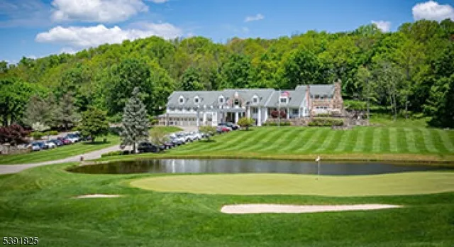 a view of a golf course with a house