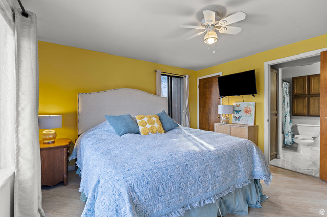 320 North 150 West Logan, UT 84321 - Photo 8 of 22 Bedroom featuring ceiling fan, a closet, and wood finished floors